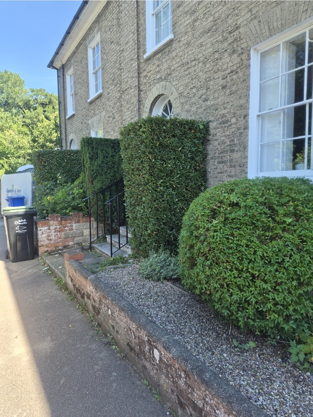 Neatly cut hedges at a terraced house in Beccles, Suffolk
